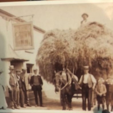 Cart or hay waggon outside an Inn